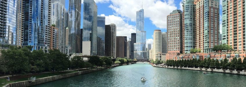 straight forward view of city skyscrapers over river