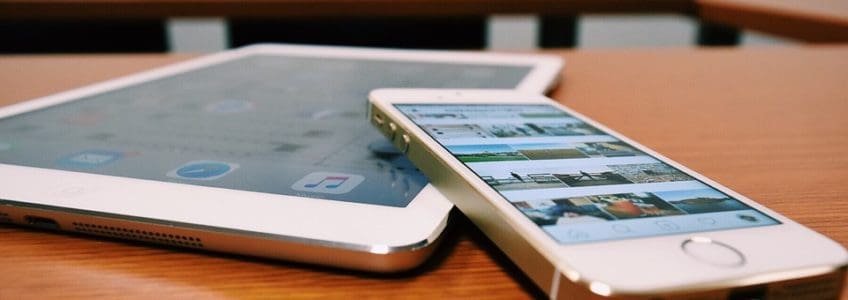 phone and tablet device sit on table