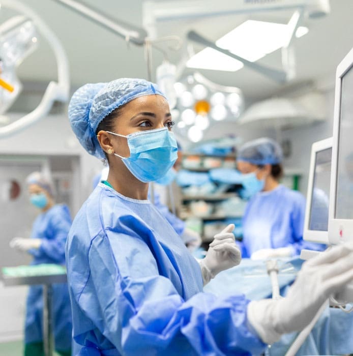 exam operating room technician reviews screen