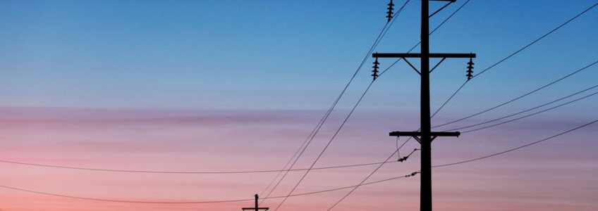 telephone wire and poles at sunset