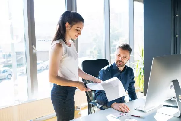 woman and man review provisioning paperwork