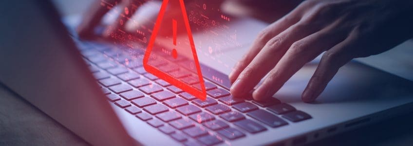 System hacked warning alert on laptop